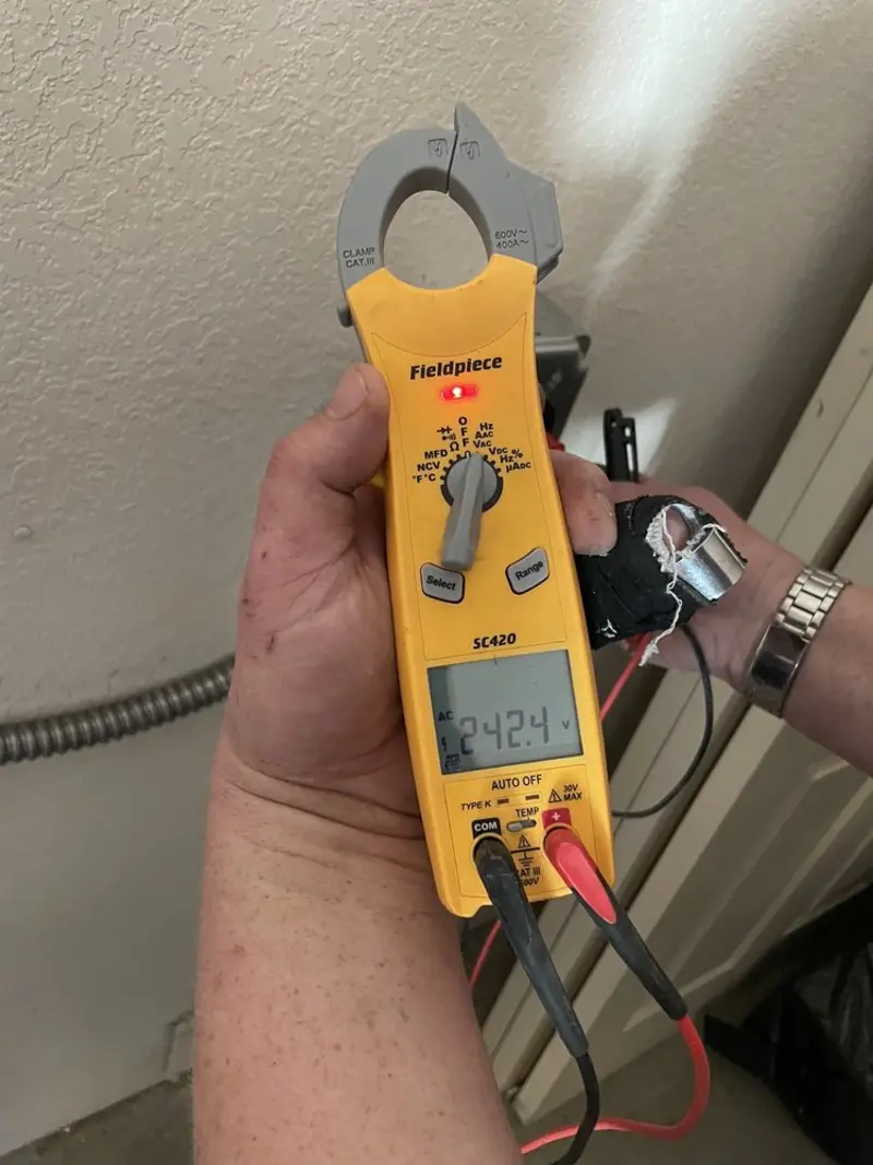 Voltage testing with clamp meter during Electrical Installation Services in Pittsford